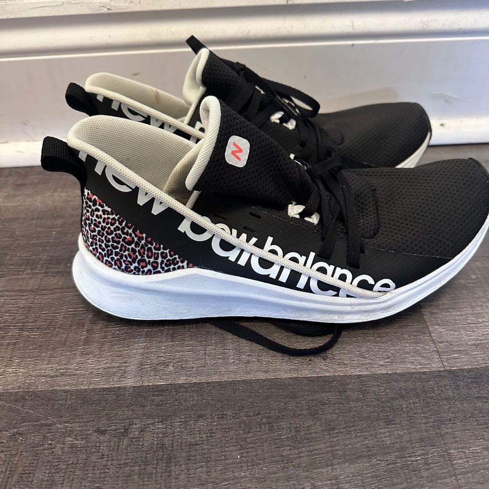 New Balance Black and White Athletic Shoes with Leopard Accent